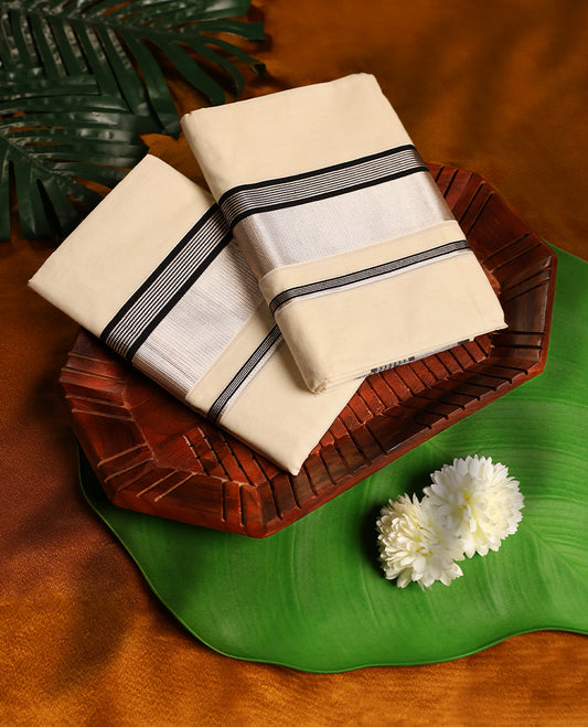 Off white colour cotton SET MUNDU featuring a plain body, complemented by a black and silver toned Bold border( 2.00/2.80 MTS).