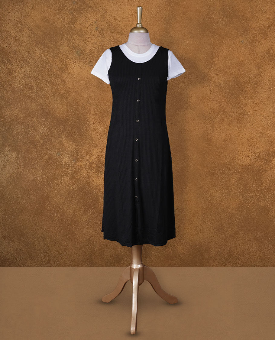 Black sleeveless A-line midi dress with front button detailing, layered over a white crew-neck short-sleeve inner tee