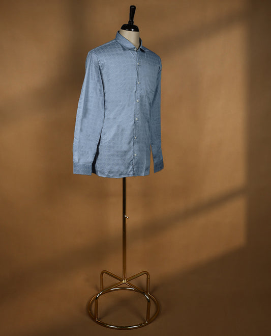 Slate blue Peter Eglend men’s cotton shirt in a relaxed formal fit, featuring an all over geometric self-design, full sleeves, classic collar, and chest pocket perfect for office and semi formal occasions.