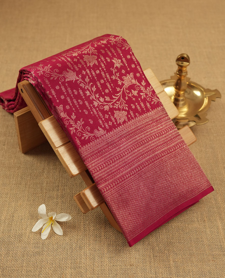 Ruby red colour Kanchipuram pattern Manthrakodi saree featuring antique kodi zari jacquard design on the body, complemented with a graceful self turning border and a matching zari jacquard blouse piece.