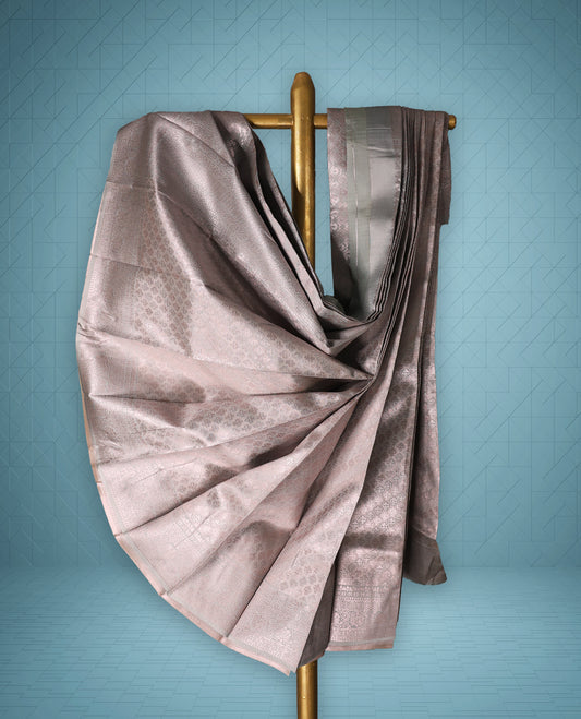 Pastel Rose Gold colour semi tissue saree featuring a brocade body, Contrast border, and a matching Contrast blouse.