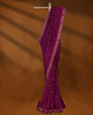 Deep Magenta colour soft khadi cotton saree with small Beige Zari Flower motifs on the body, detailed woven Gold zari border, paired pallu with tussles, with matching blouse.