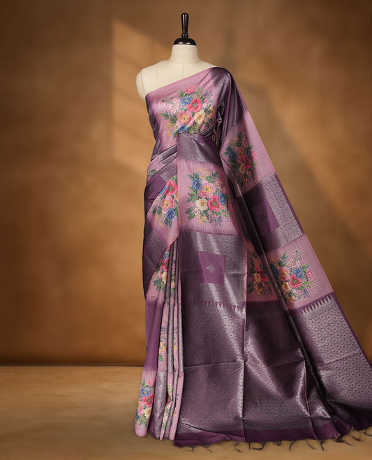 Grape color semi tussar Banarasi saree featuring vibrant multi-color floral prints across the body, with shimmering geometric zari patterns, a rich gray-red border, and a matching blouse detailed with silver woven buttas.
