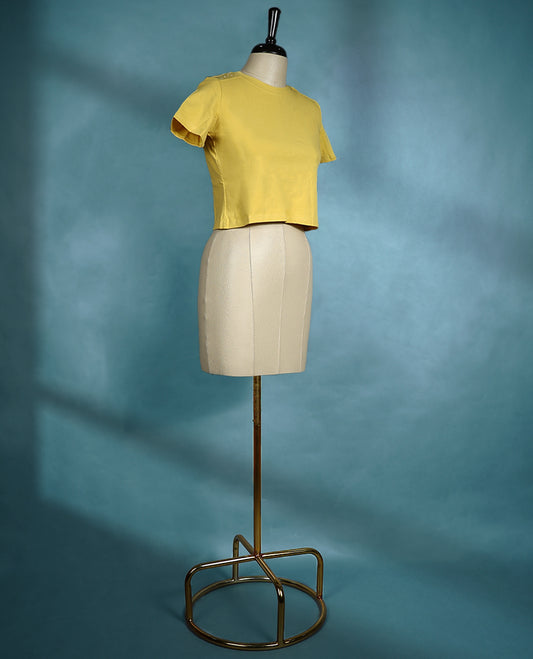 Mustard yellow round neck T shirt with short sleeves, featuring a fitted silhouette and minimal design for a sleek, everyday look.