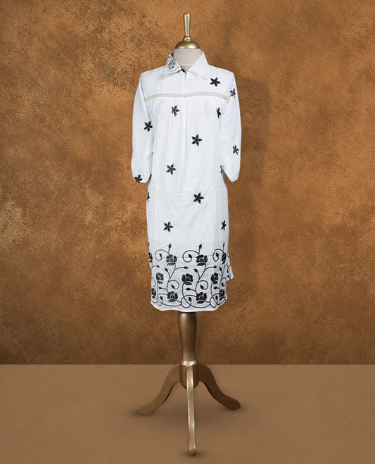 White embroidered nightwear kurti with contrast black floral motifs, crochet-detailed shirt collar, front yoke gathers, and three-quarter sleeves with elasticated hem
