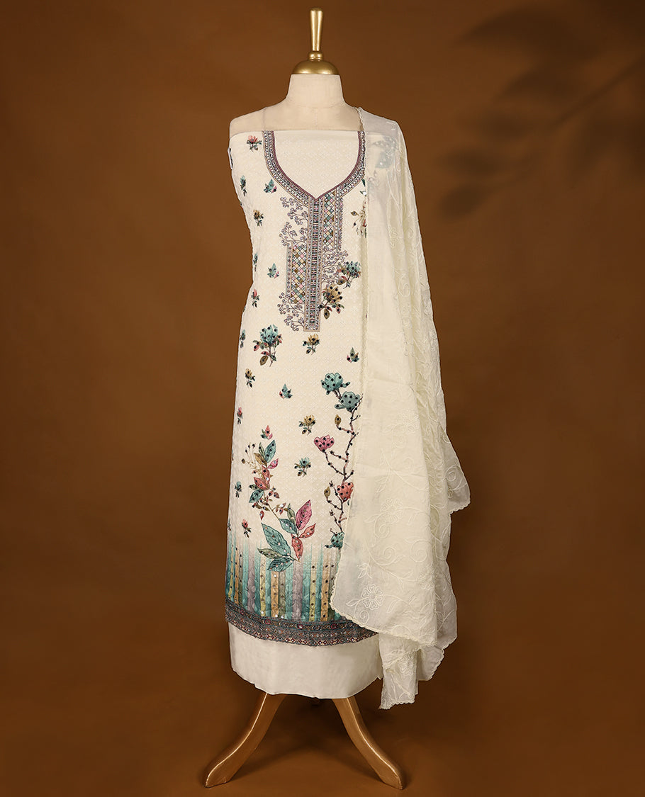 Off-white embroidered top with multi-colour prints & green border, includes matching bottom and threadwork dupatta.