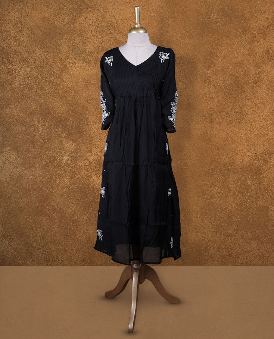 Black colour kurti with white colour colour thread pattern across the body, knee length design, styled with a V neckline and a  sleeve .