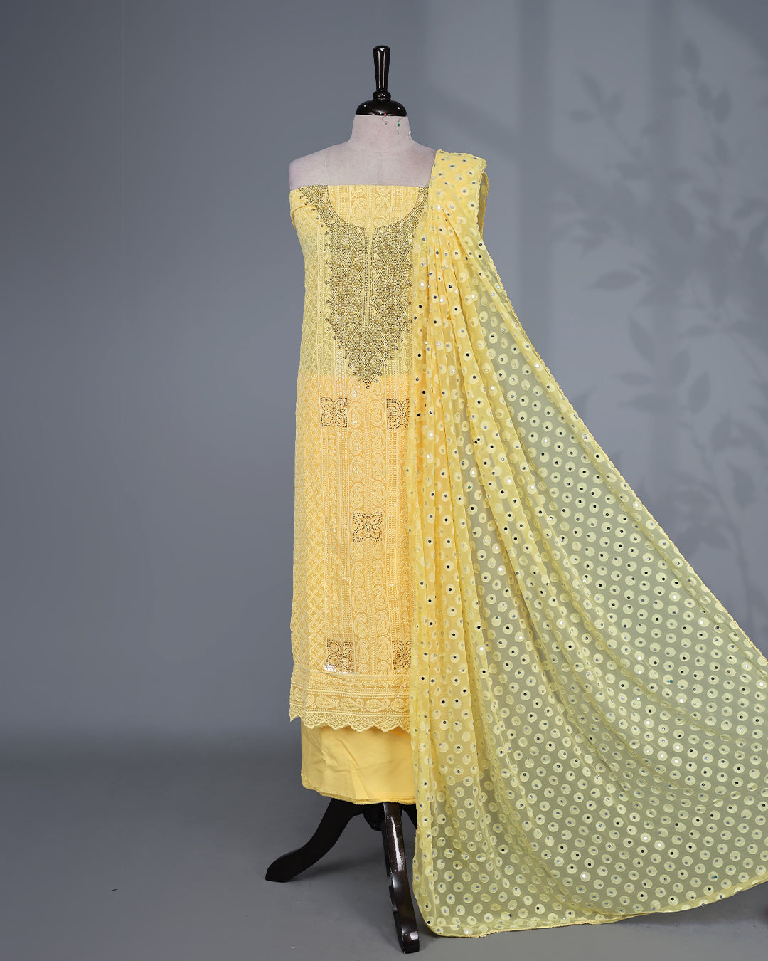 Yellow Colour Georgette Salwar Material featuring elegant Chikankari work on the kurta, paired with a matching bottom and a sequins-embellished dupatta.