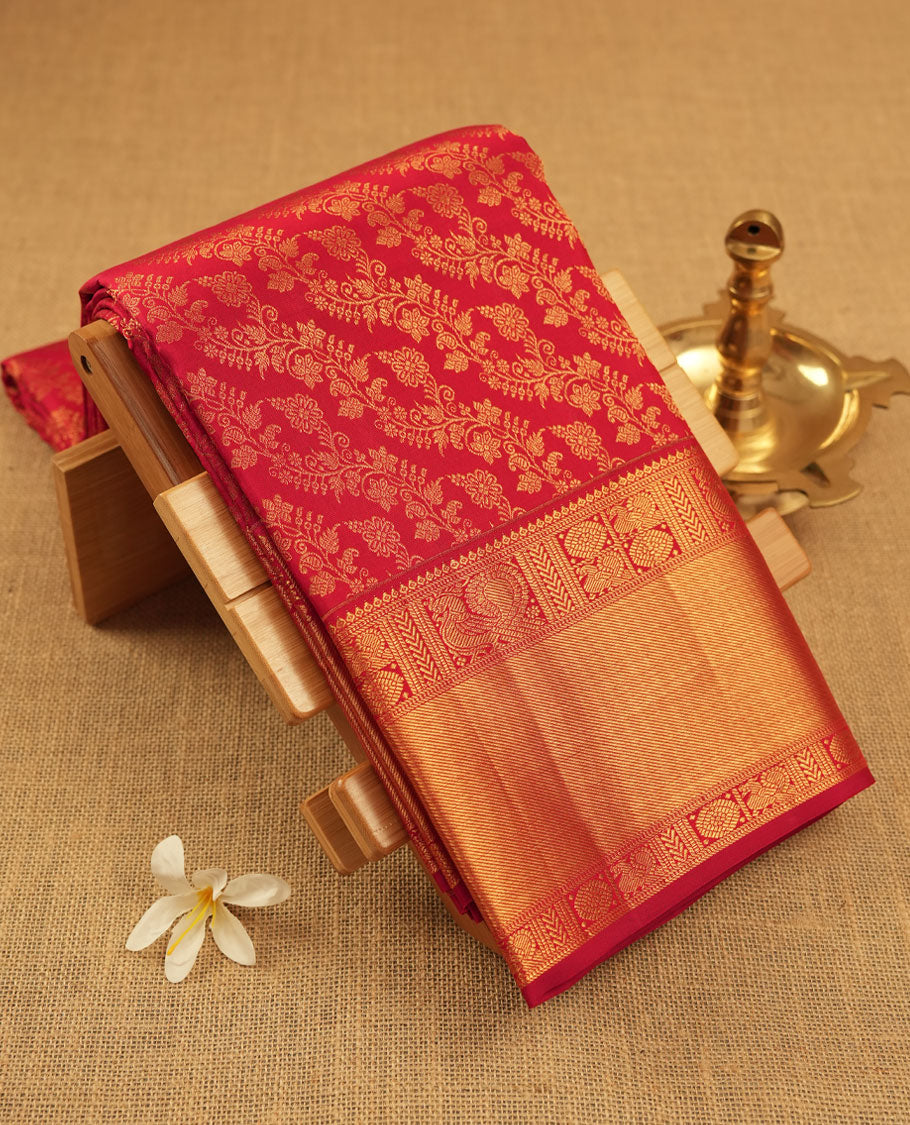 Maroon colour Kanchipuram pattern Manthrakodi saree featuring traditional golden zari cross kodi jacquard pattern all over, traditional peacock motifs on border and self zari jacquard blouse piece.