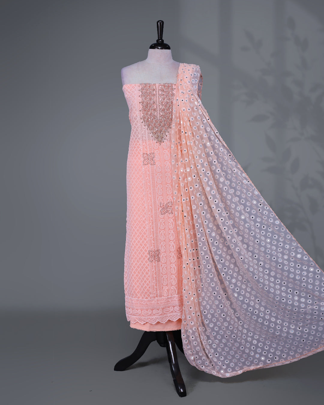 Peach  Colour Georgette Salwar Material featuring elegant Chikankari work on the kurta, paired with a matching bottom and a sequins-embellished dupatta.