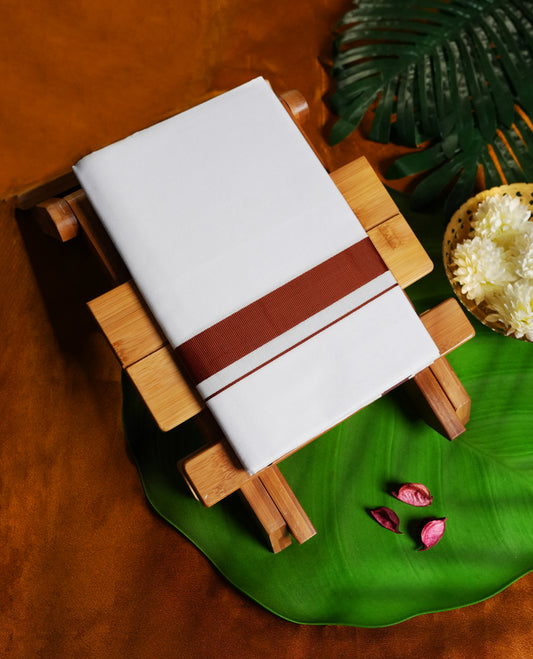 White colour cotton dhoti with a bold rust brown border. Soft, breathable, and ideal for traditional ceremonies, temple visits, or festive wear. A perfect blend of simplicity and style.
