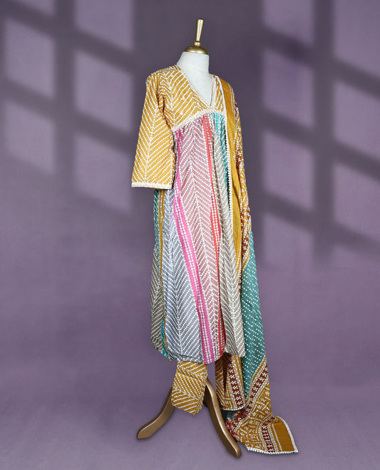 Multicolour cotton salwar set with bandhani style print in mustard, pink, grey and blue, featuring a V neck and elbow sleeves, paired with matching printed bottom and floral geometric printed dupatta.