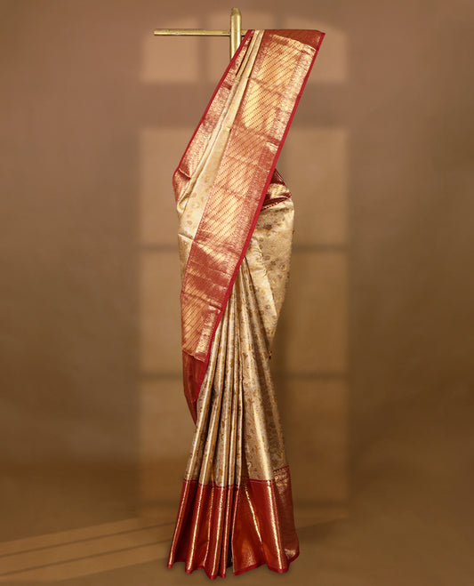 Gold colour tissue brocade saree with gold and silver zari floral kodi design on body, gold zari traditional floral and peacock work Maroon border, rich matching pallu with Antique zari motifs, paired with matching blouse.