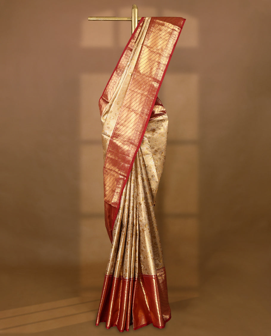 Gold colour tissue brocade saree with gold and silver zari floral kodi design on body, gold zari traditional floral and peacock work Maroon border, rich matching pallu with Antique zari motifs, paired with matching blouse.