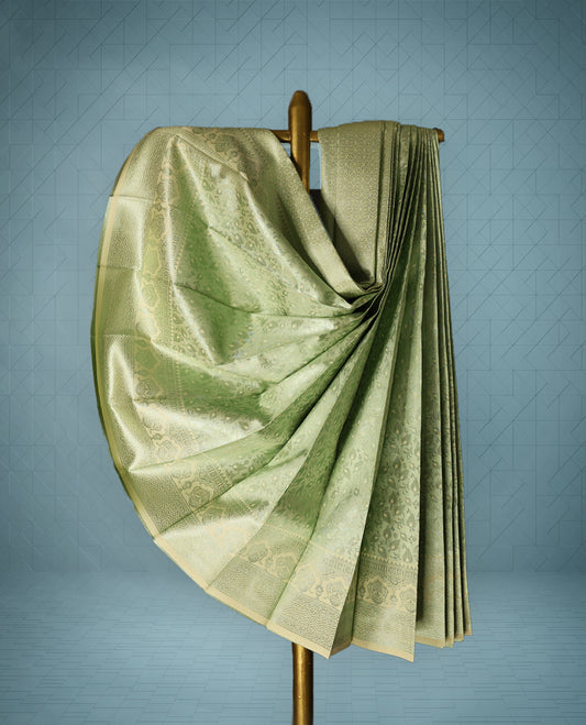 Light Green colour Semi tissue saree featuring a brocade body, self coloured zari border, and a matching self coloured blouse.