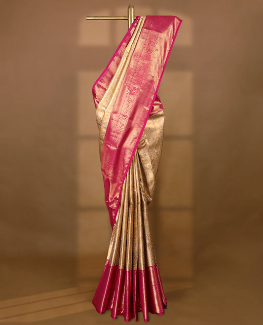 Gold colour tissue brocade saree with gold and silver zari kodi design on body, gold zari traditional magenta border, rich matching pallu with Antique zari motifs, paired with matching blouse.
