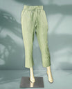 Light green colour women's pants feature a breathable textured fabric with a relaxed fit, elastic waistband, and drawstring closure