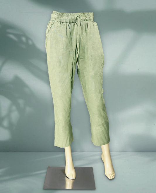 Light green colour women's pants feature a breathable textured fabric with a relaxed fit, elastic waistband, and drawstring closure