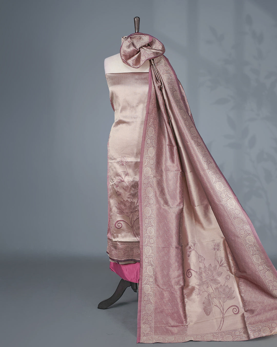 Purple Colour Tissue Salwar Material featuring elegant lotus floral motifs on the front panel, paired with a matching bottom and dupatta for a timeless, sophisticated look.