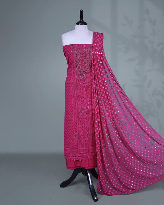 Magenta Colour Georgette Salwar Material featuring elegant Chikankari work on the kurta, paired with a matching bottom and a sequins-embellished dupatta.
