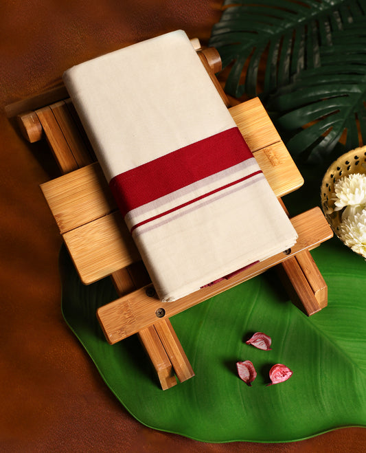 Off white cotton single dhoti featuring a deep red kara with fine double line edging, crafted for traditional elegance and daily comfort, perfect for rituals, temple visits, and cultural occasions.