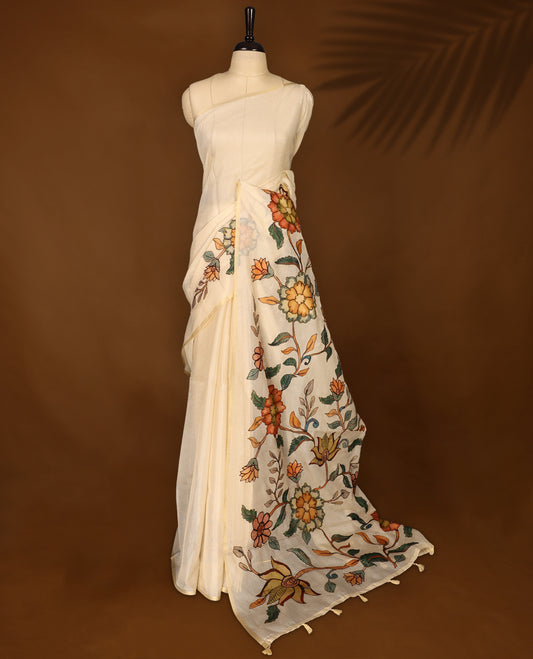 Graceful off white Kota net saree adorned with vibrant hand painted floral motifs on the pallu, blending subtle elegance with artistic charm & A perfect pick for festive gatherings and cultural occasions.
