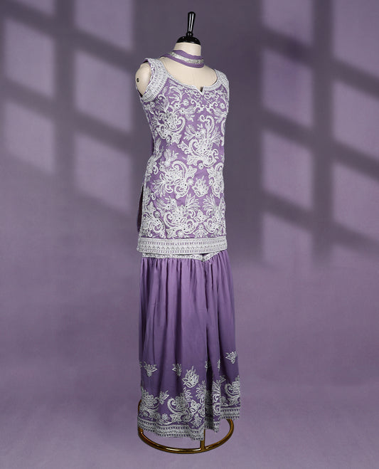 Lavender Colour sharara set features a sweetheart neck with intricate embroidery, sleeveless design, with contrast bottom and dupatta