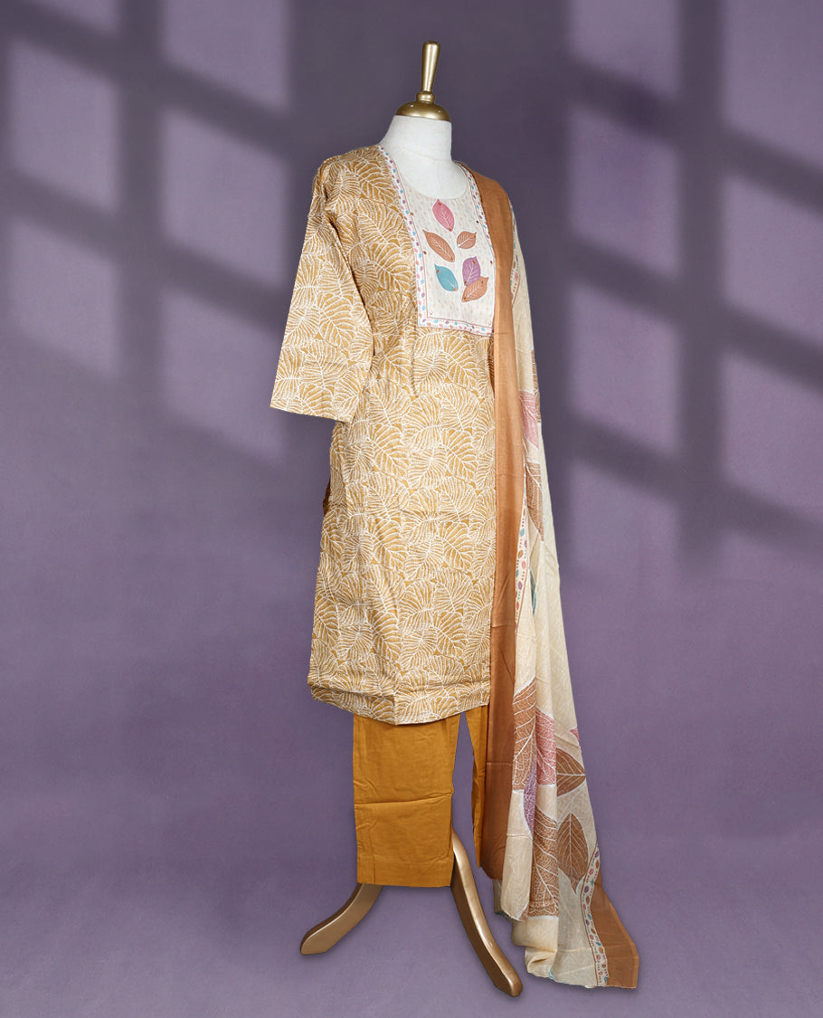 Mustard and beige colour salwar set with round neck and elbow sleeves features leaf printed yoke and all over line floral design paired with matching plain bottom and multicolour leaf print dupatta