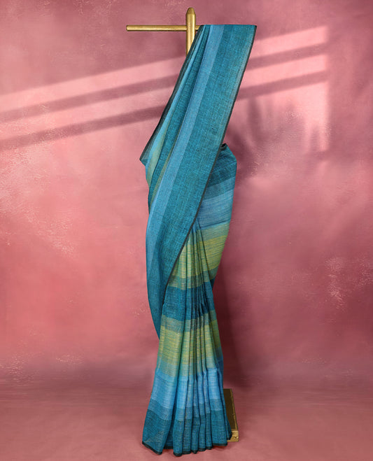 Teal and blue colour pure linen saree featuring broad horizontal stripes in shades of green and sky blue, complemented by a sleek self border and comes with a matching blouse