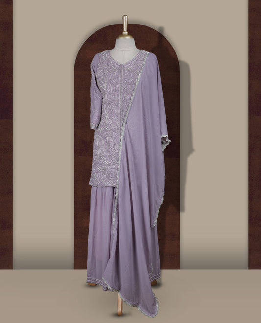 Elegant Lavender colour sharara set featuring an intricately embroidered top with cut beads work and three quarter sleeves, paired with a flowy flared bottom and a matching dupatta adorned with delicate borders.