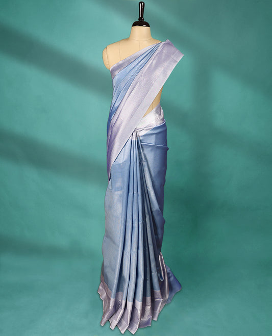 Light Blue coloured semi silk saree featuring a Check design on the body, paired with a Baby Blue coloured border and matching blouse.
