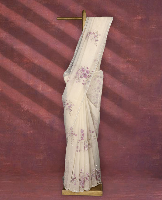 White colour pure organza saree featuring Light Purple floral prints with intricate bead and sequin work across the body, adorned with a matching embellished border, complemented by a worked pallu and paired with a heavily worked matching blouse.