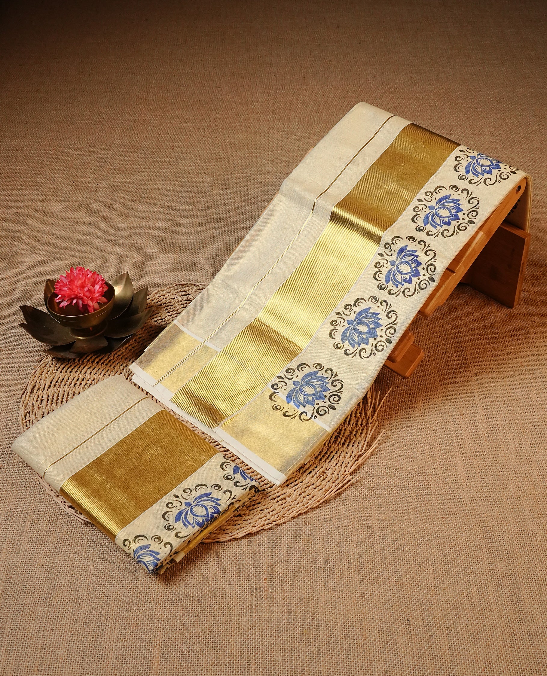 Cream colour Tissue silk set mund Featuring Elegant plain body, Complemented by Floral print with zari border.