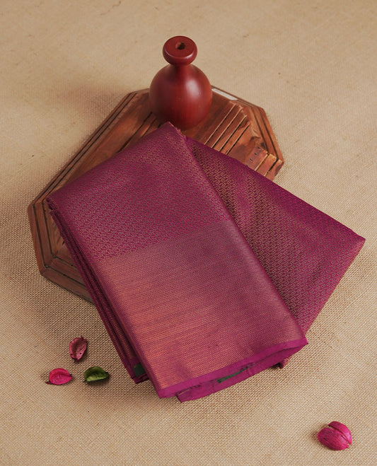 Plum colour semi silk saree featuring neem zari Brocade Pattern all over the body, complemented by a Self Colour woven border with detailing with contrast green Colour Pallu & blouse.