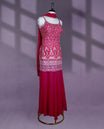 Vibrant raspberry pink colour sharara set features a sleeveless spaghetti strap top with intricate multicolor floral and geometric embroidery, paired with a solid flared bottom and a light, graceful dupatta