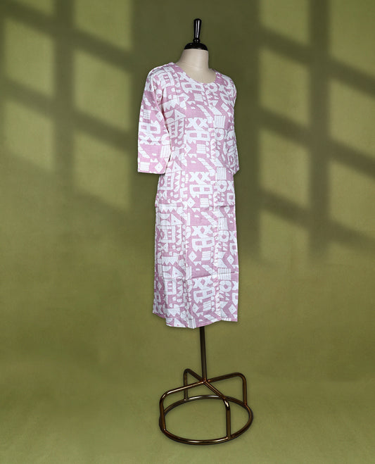 Soft mauve and white printed kurti with abstract geometric patterns, styled with a round neckline, front button placket, and 3/4th sleeves, ideal for smart casual or daily wear.