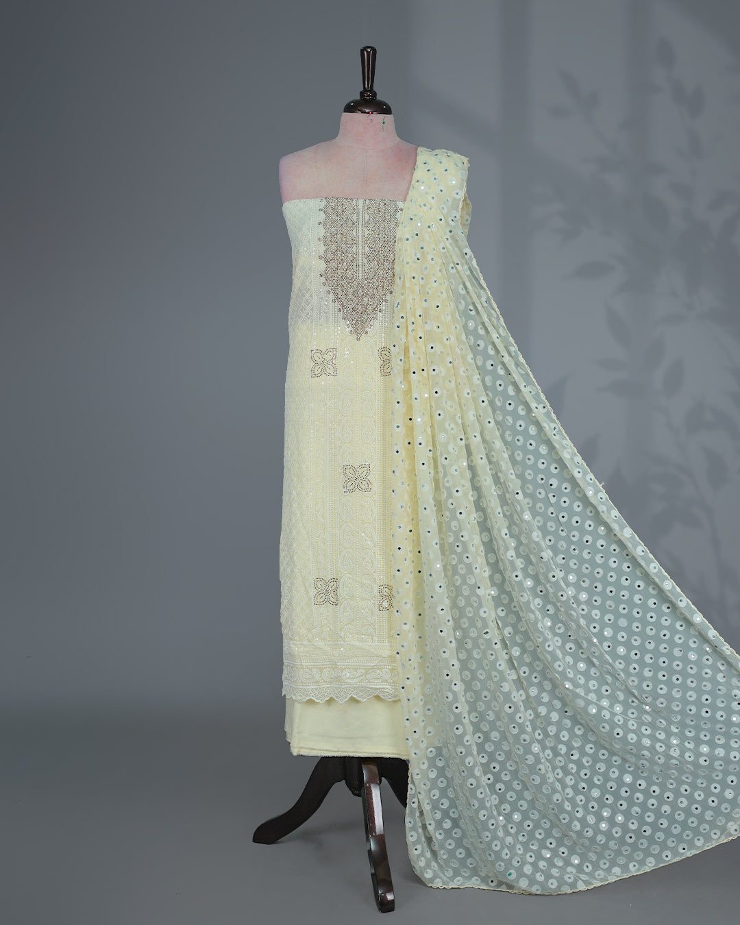 Butter Yellow Colour  Georgette Salwar Material featuring elegant Chikankari work on the kurta, paired with a matching bottom and a sequins-embellished dupatta.