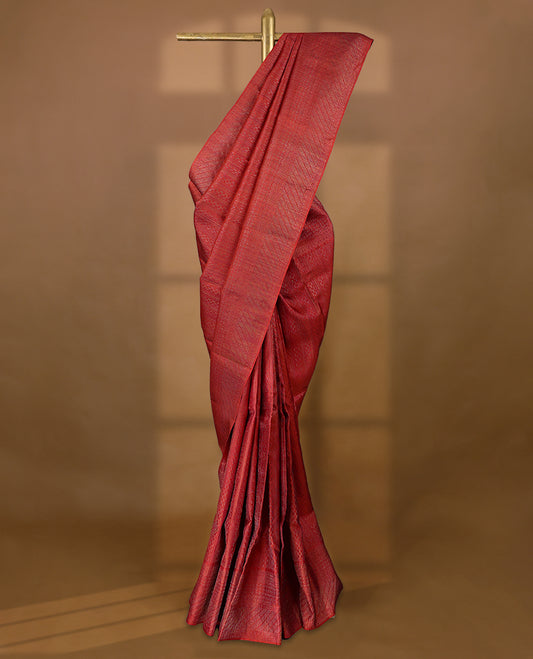 Red coloured Manthrakodi saree featuring a multicoloured zari jacquard body, complemented by a self coloured turning Banarasi border and a matching self coloured blouse.