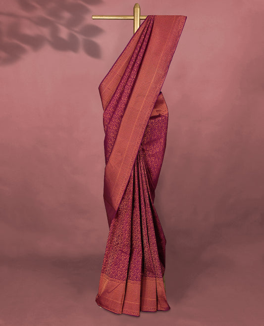 Bordeaux colour Kancheepuram saree featuring an antique zari brocade body, complemented by a traditional border and a matching blouse.