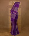 Deep royal purple Colour Kancheepuram designer saree adorned with antique zari large mango motifs, floral kodi work, and vertical gold zari lines on the body, designed without a border, and paired with a matching blouse.