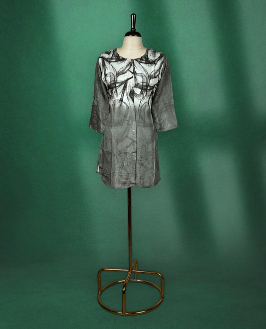 Stylish black and grey short kurti featuring a smoky abstract print, button down front, round neckline, and 3/4th sleeves perfect for a chic casual look.