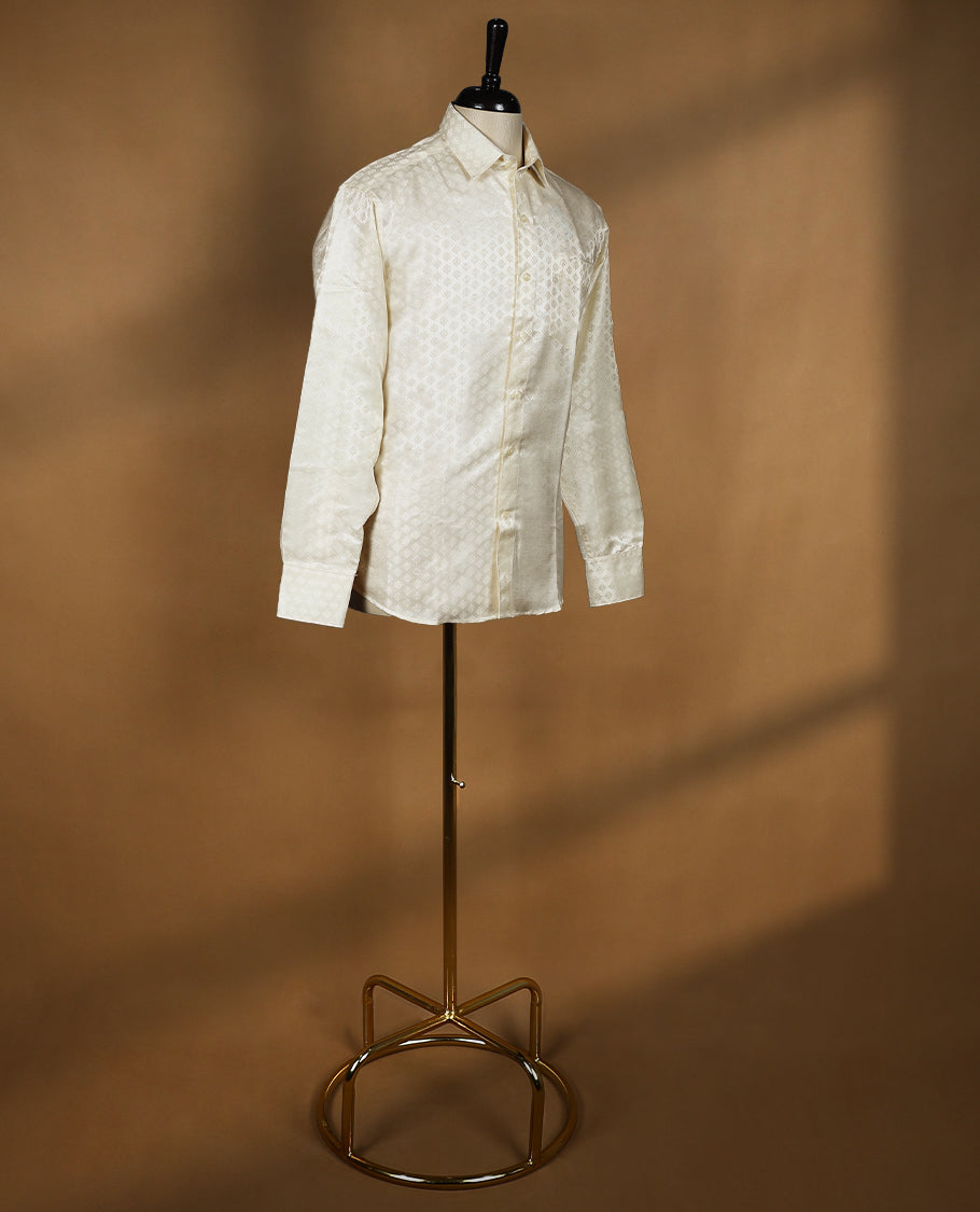 Cream ivory Denim Marton men's wedding shirt with a glossy finish, featuring diamond jacquard self-design, full sleeves, classic collar, and a chest pocket.