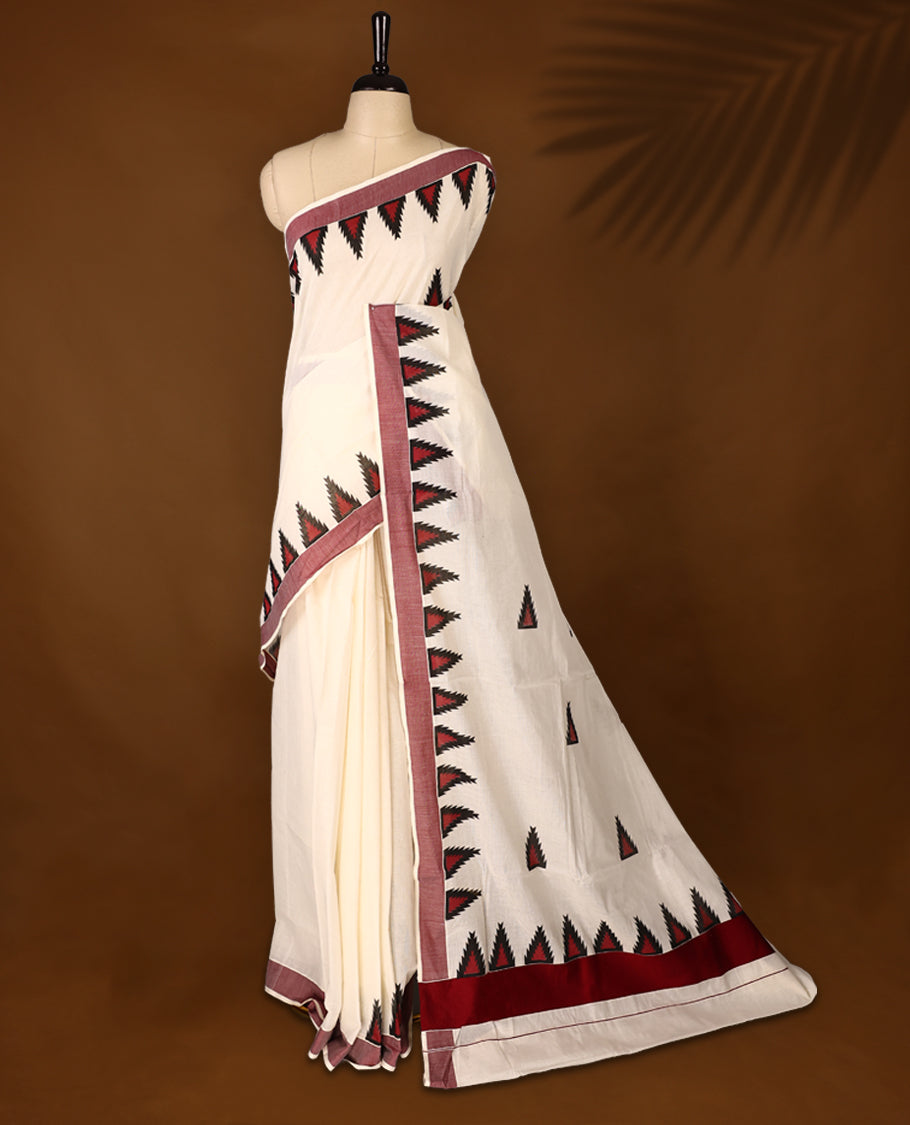 Elegant off white colour cotton Kerala saree featuring Plain body, Maroon colour border with temple designs, Paired with matching blouse offering a classic and graceful look, paired with a matching blouse.