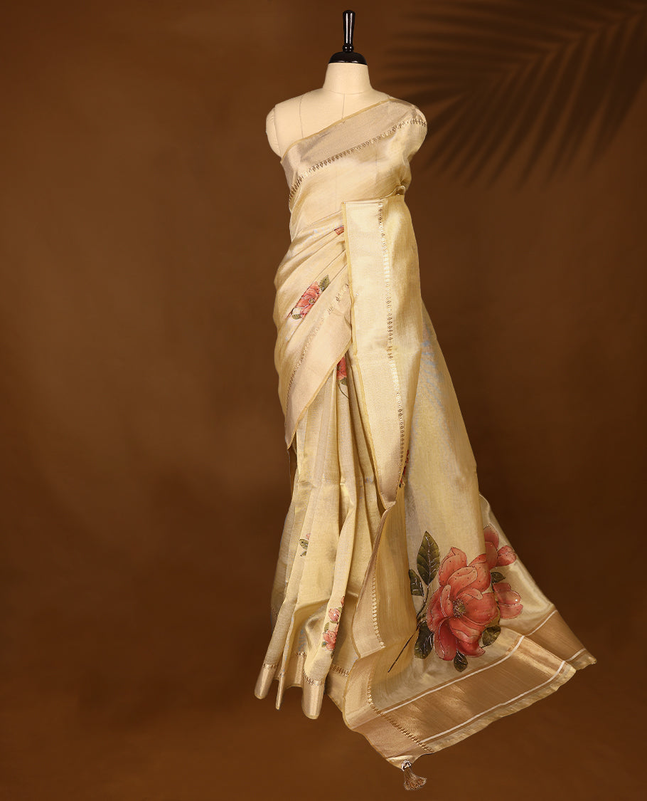Light gold colour Organza Kerala saree with a sheer, smooth body and soft golden sheen. Accented with a fine zari border and subtle floral motifs near the pleats, Comes paired with a coordinated matching blouse.