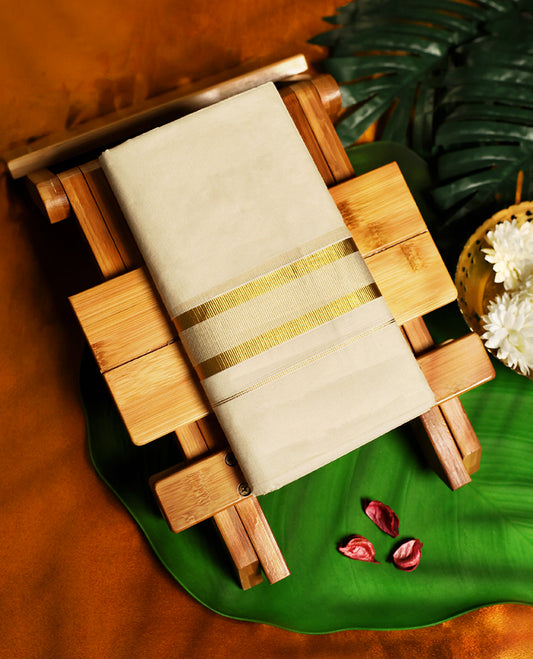 Off white colour cotton double dhoti with a subtle golden zari border, crafted for traditional elegance and breathable comfort, ideal for festivals, weddings, and cultural celebrations.
