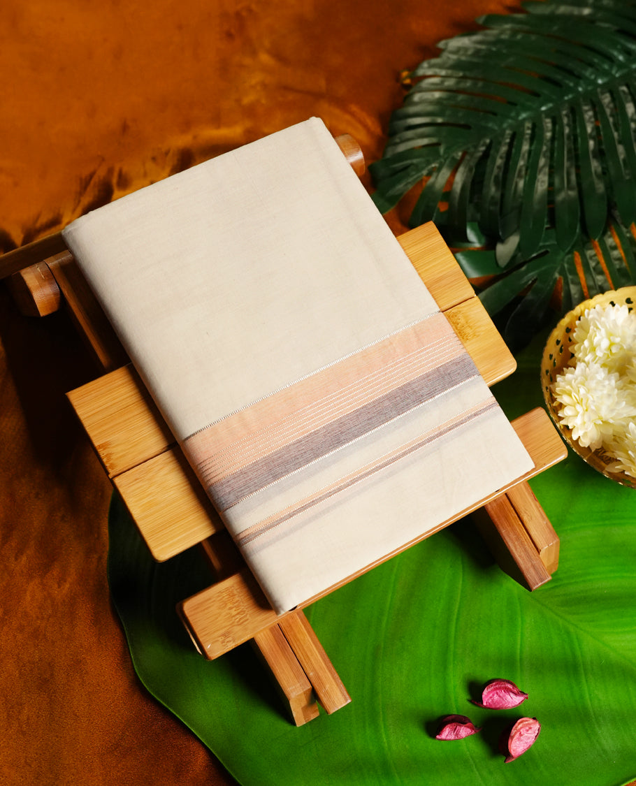 Off white colour cotton single dhoti featuring a dual tone soft peach and grey kara with fine line detailing & Designed for daily comfort and traditional grace, ideal for rituals, cultural events, and festive wear.
