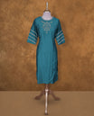 Teal blue colour kurti BY VISMAY with subtle thread embroidery, straight calf length silhouette, featuring a round neckline and stylish three quarter sleeves with striped detailing.
