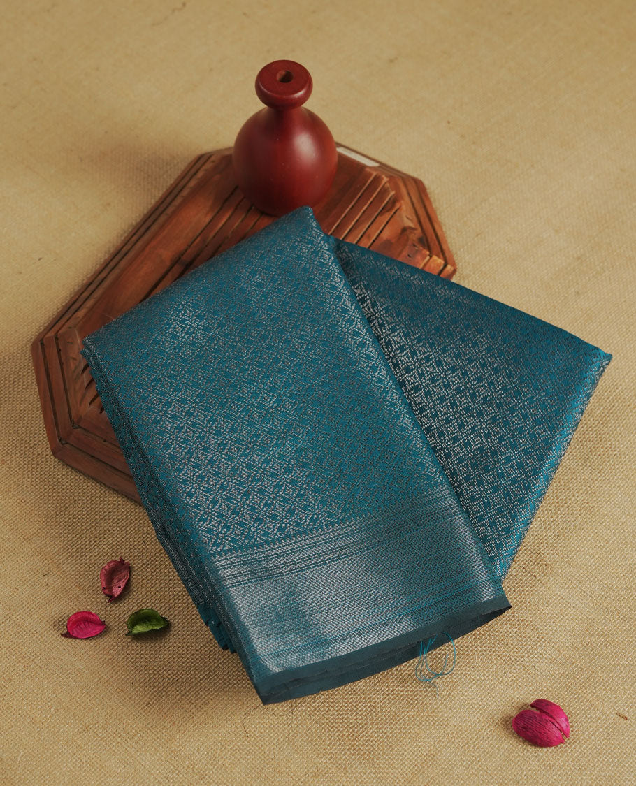 Aqua blue colour semi silk saree featuring neem zari Brocade Pattern all over the body, complemented by a Self Colour woven border with detailing, Pallu & blouse.