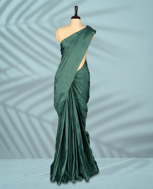 Pastel teal green Colour semi silk saree features subtle Silver zari check patterns throughout and Self Colour border, comes with a matching blouse