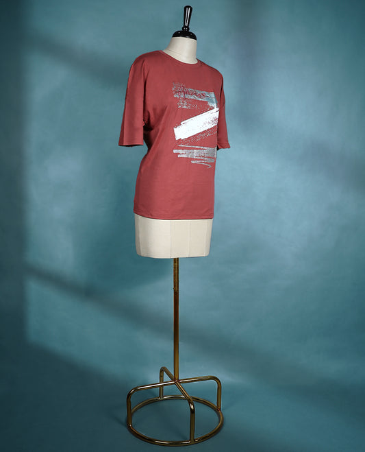 Brick red Colour oversized T shirt with short sleeves and a round neck, featuring bold abstract brushstroke graphics in white and gray tones.